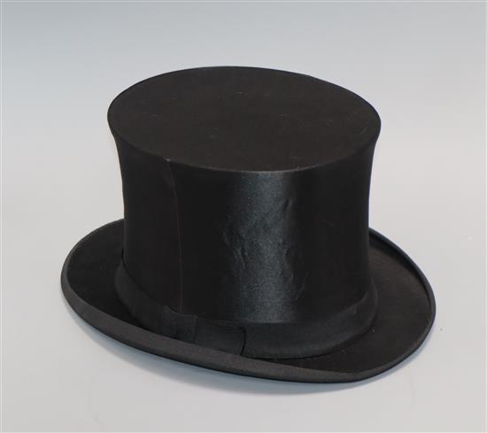 A French silk collapsible black top hat with box, Paris manufacturer and a collection of childs white clothing